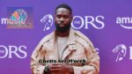 UK grime rapper at a music awards event representing the topic ghetts net worth, career success and music industry earnings
